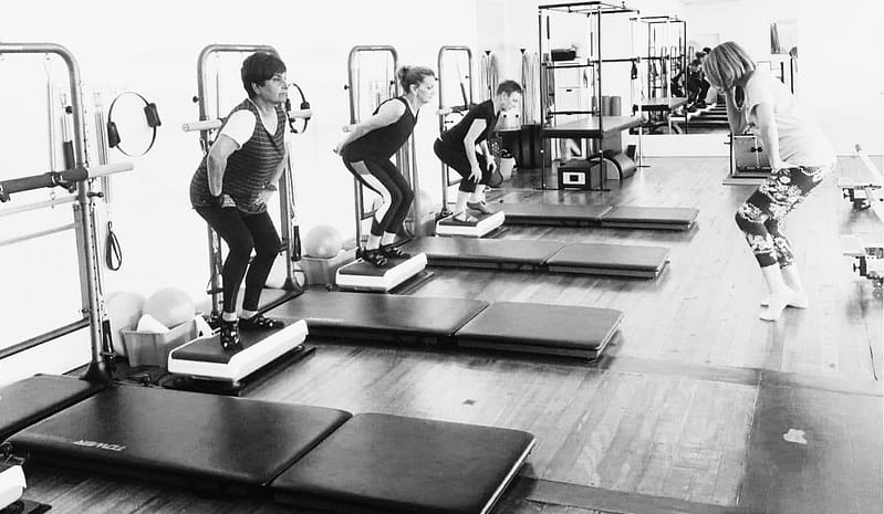 women doing squats on the hypervibe