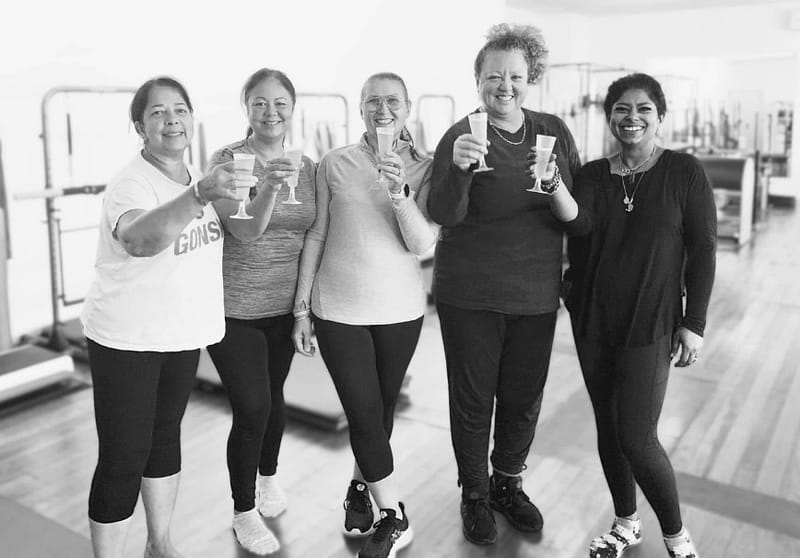 group of women looking happy after pilates class