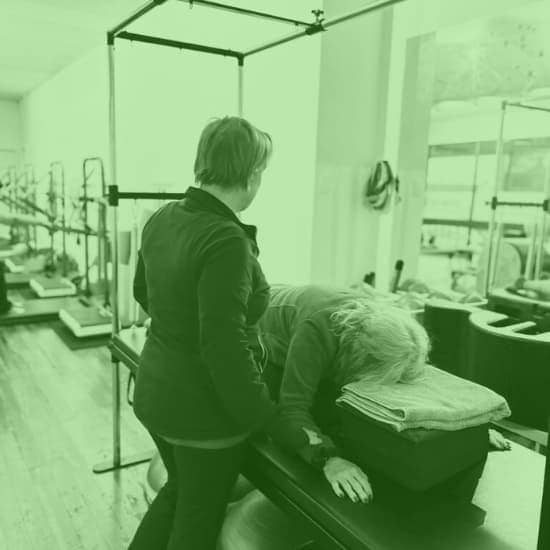 Woman instructing a Private Pilates Session in Cheltenham